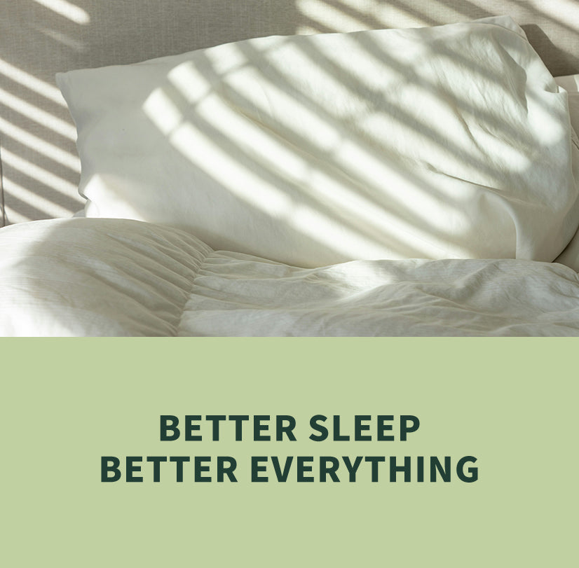 White bedding with a large pillow under soft window shadow patterns, with a light green banner at the bottom reading 'BETTER SLEEP BETTER EVERYTHING'.